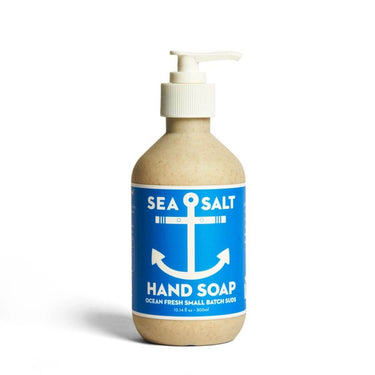 Bottle of sea salt hand soap with a blue label and white pump on a white background
